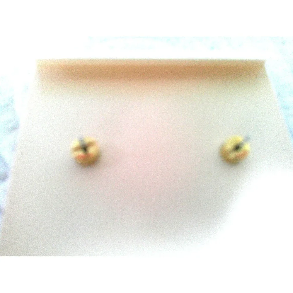 Michael Kors Sapphire and Diamond Earrings. One tiny stone missing. Retailed $85